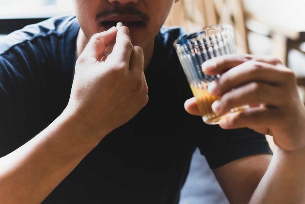 Xanax-and-Alcohol man mixing xanax and alcohol in need of alcohol addiction treatment center