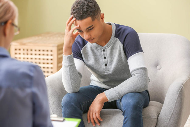 Teen boy in a mental health treatment session