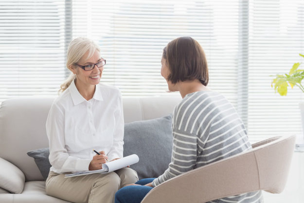 Woman in a therapy session as part of her 12 step program